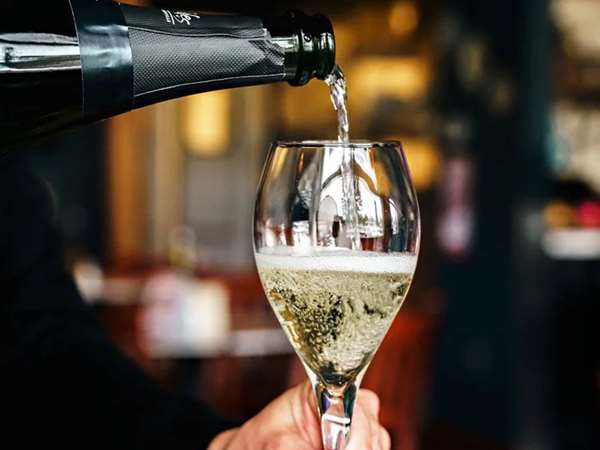 Pouring a glass of champagne. 