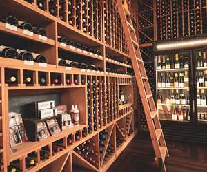 Flights Wine Bar interior featuring a large inventory of wines.