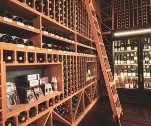 Flights Wine Bar interior featuring a large inventory of wines.
